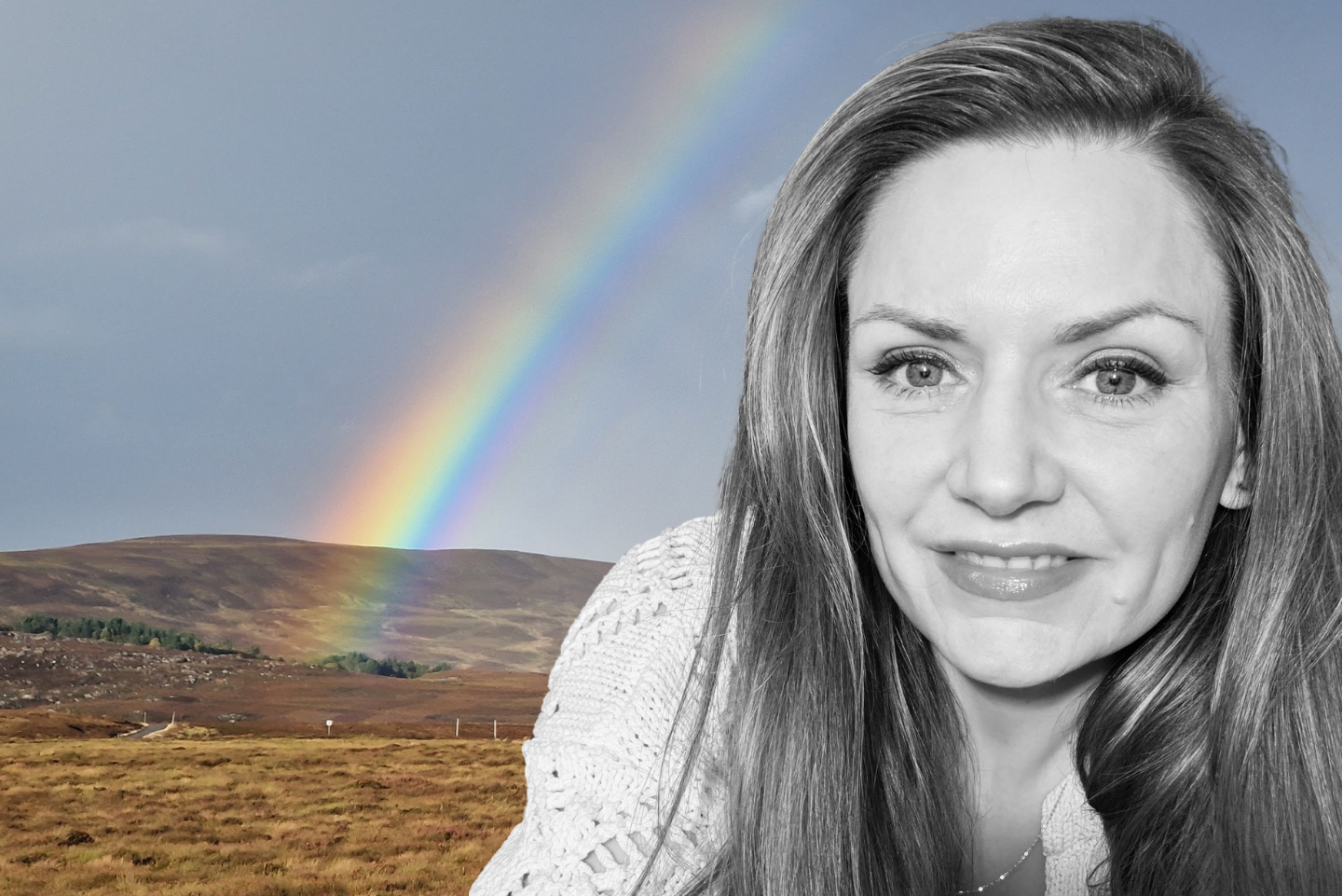 Woman in a knitted sweater with a rainbow in the background